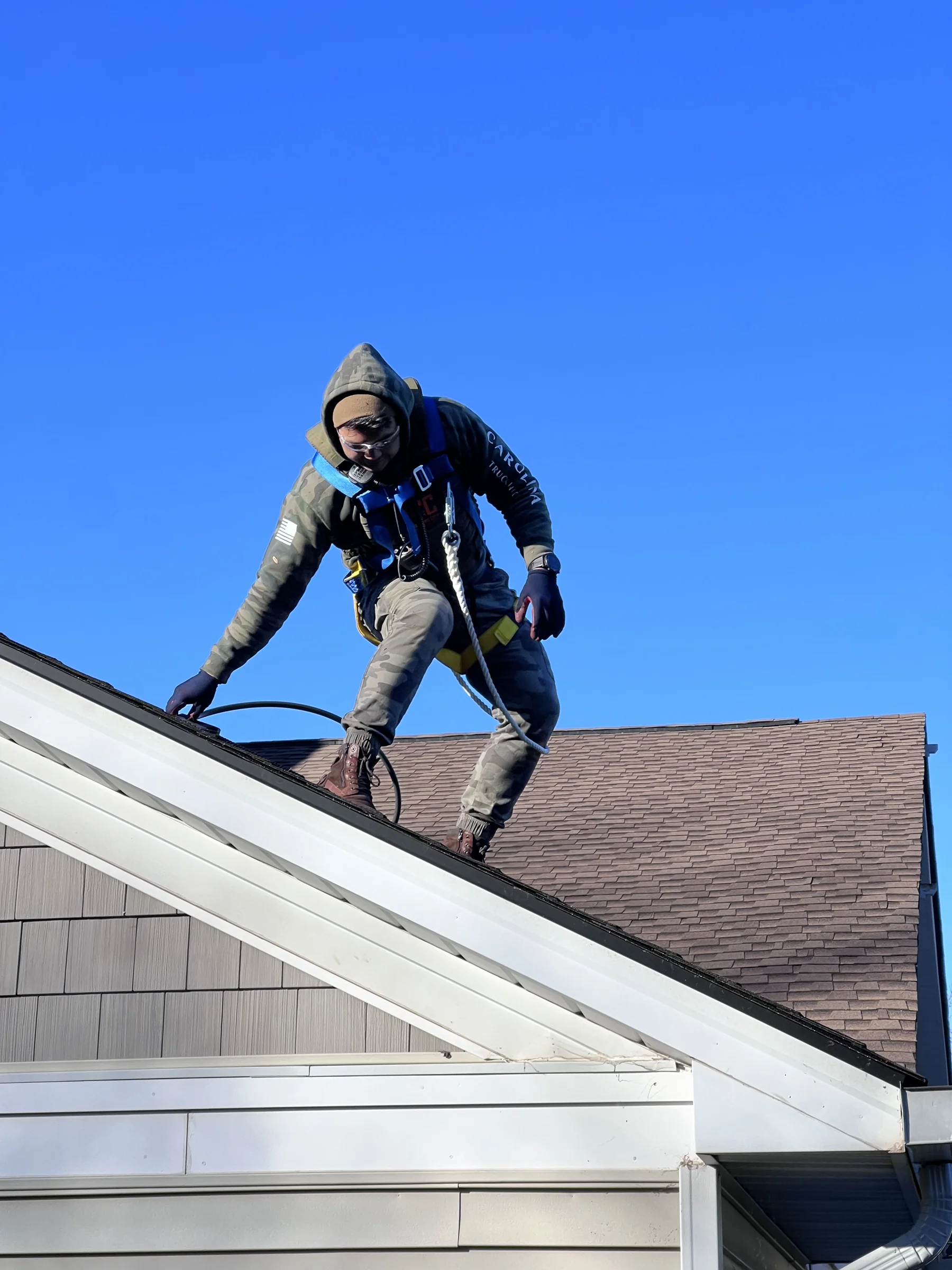 Bespoke crew member operating at height in fall-arrest harness