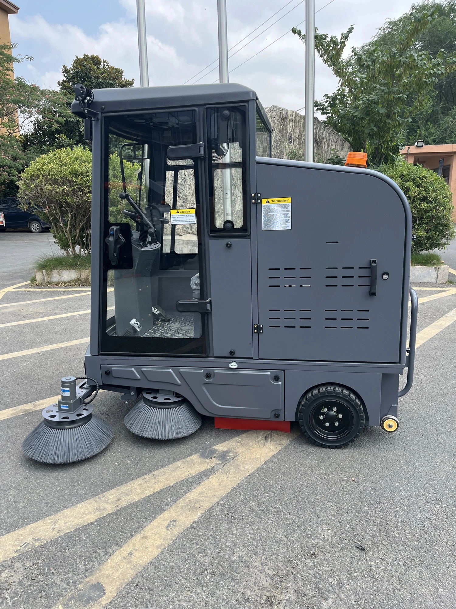 Ride-On Parking-Lot Sweeper